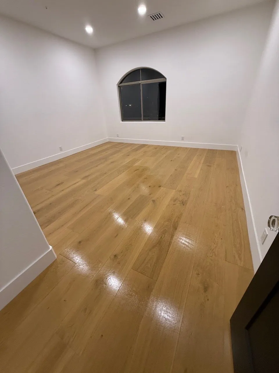 Move-in ready bedroom with gleaming hardwood floors